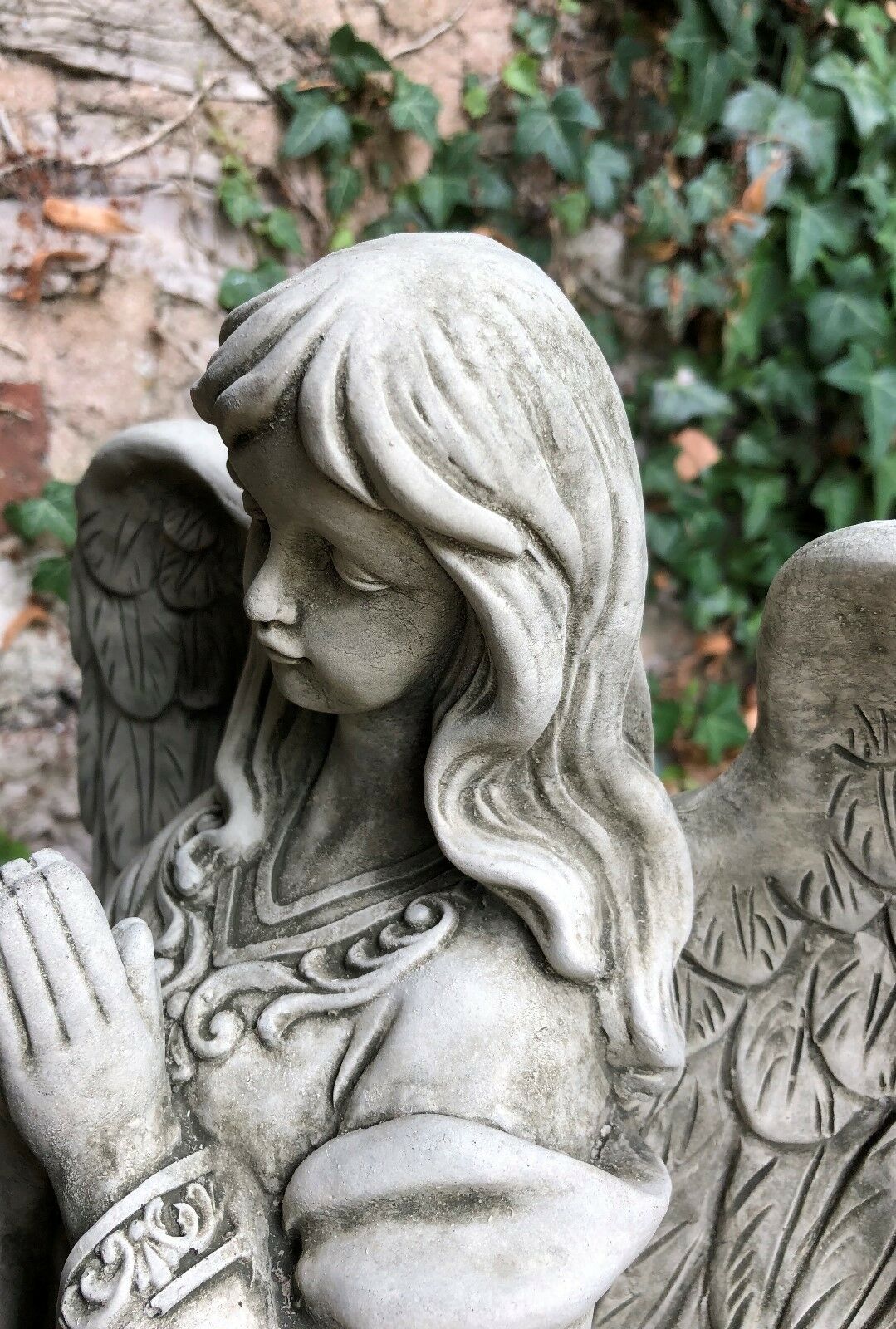 Close-up of Stone Praying Angel Statue's face and upper body, showcasing fine craftsmanship and elegant limestone finish.