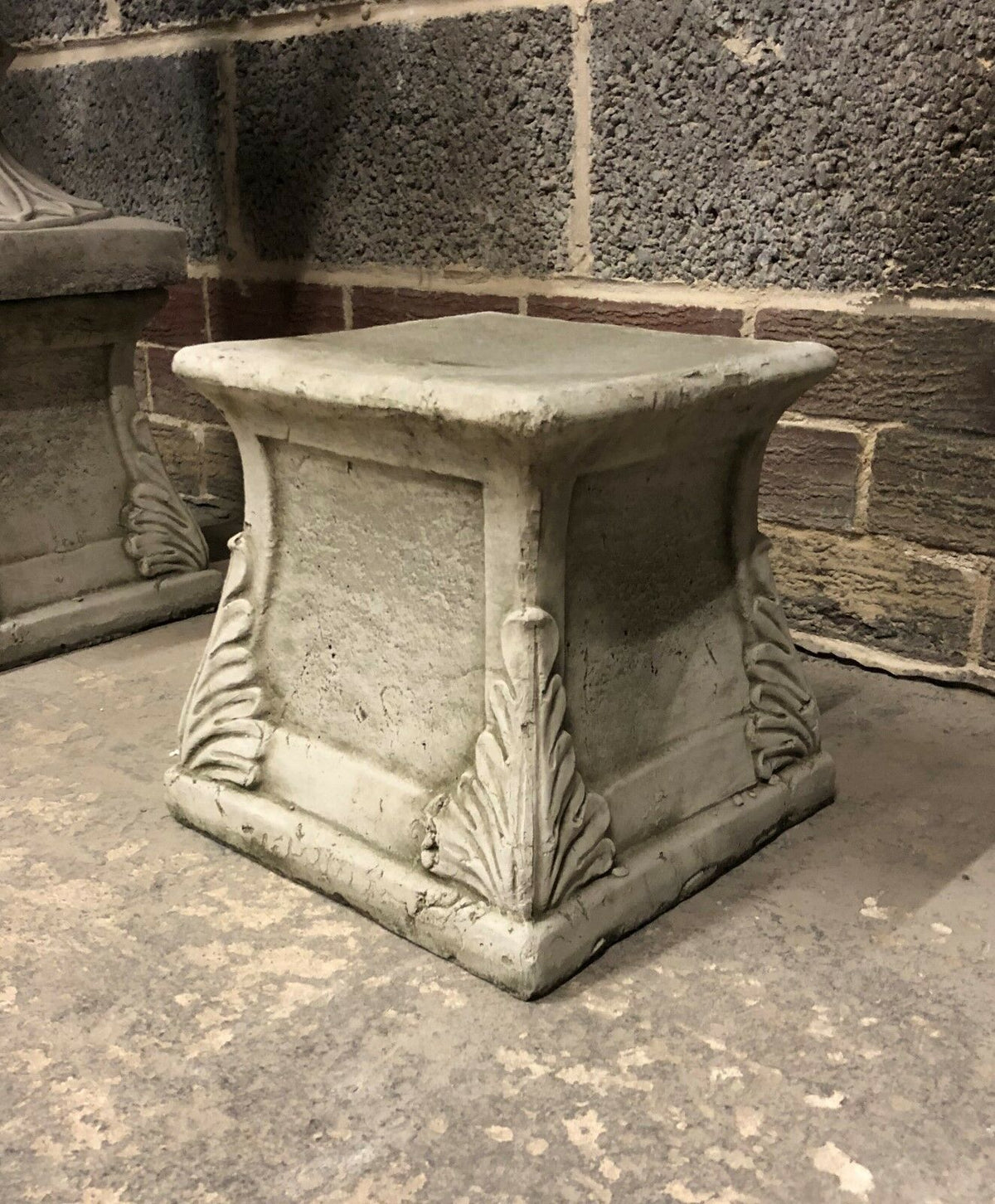 Stone Garden Sculpture Plinth featuring a classic leaf design, perfect for outdoor decoration and supporting garden statues or planters.