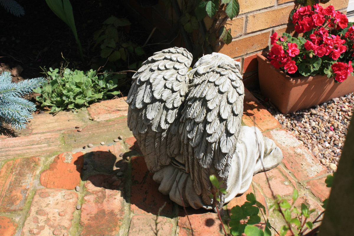 Back view of Garden Angel Statue showing detailed stone wings, highlighting craftsmanship and durability for outdoor garden settings.