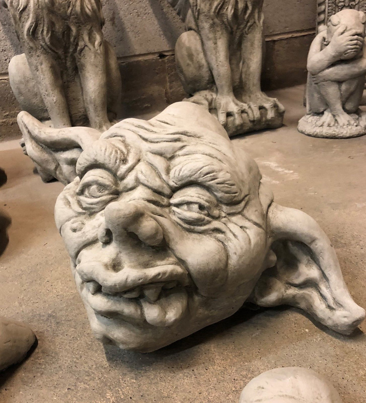 Stone Zombie Set Ornaments - Garden Decor|Limestone, Weatherproof. Side view of grotesque zombie head sculpture with exaggerated facial expression.