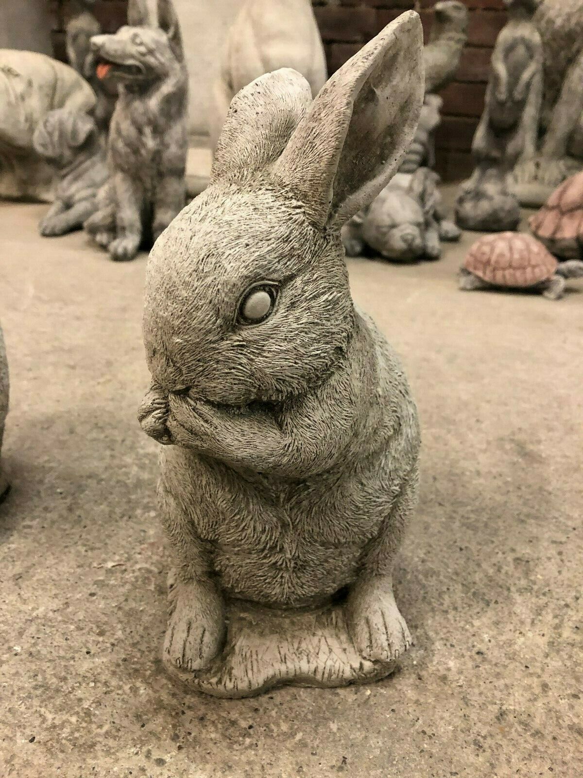 Detailed Speak No Evil rabbit statue with paw over mouth, from the stone Rabbit Trio garden decor collection.