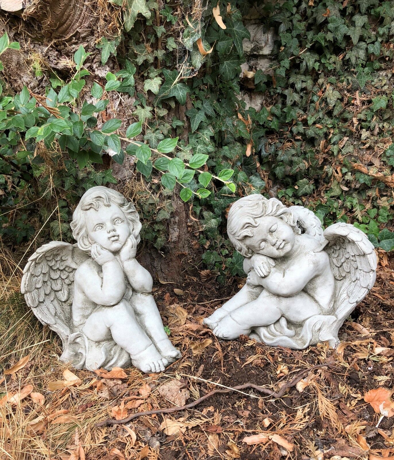 Solid stone sculpture pair of winged baby angels for garden decoration. Perfect for enhancing patios, lawns, or spiritual outdoor spaces.