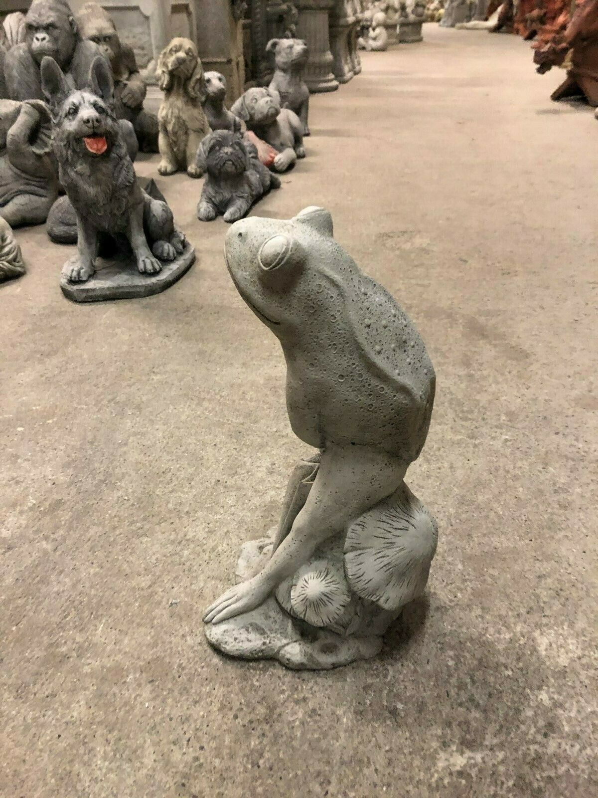 Side view of Stone Frog Garden Ornament - Elegant with Umbrella, showcasing fine limestone texture and detailed craftsmanship.