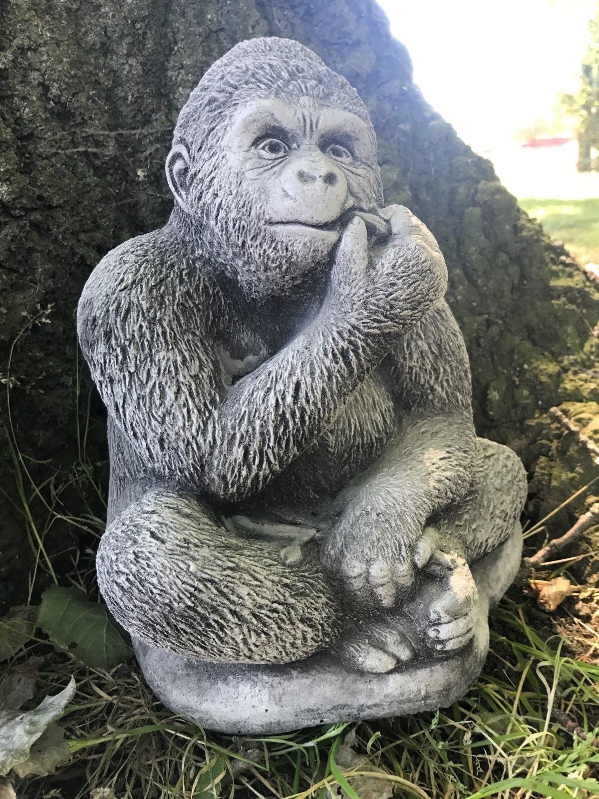 Angled view of stone gorilla garden ornament with lifelike details, a durable limestone sculpture for outdoor home decor.