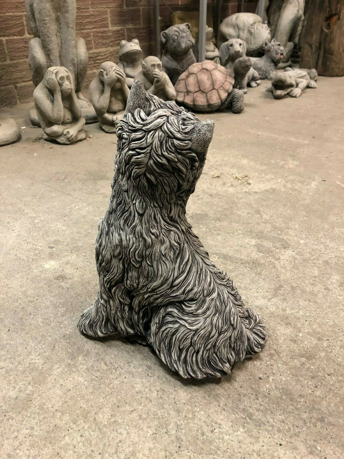 Back angle of Stone Westie Dog Statue with intricate carving. Durable garden sculpture for pet lovers, suitable for outdoor or indoor use.