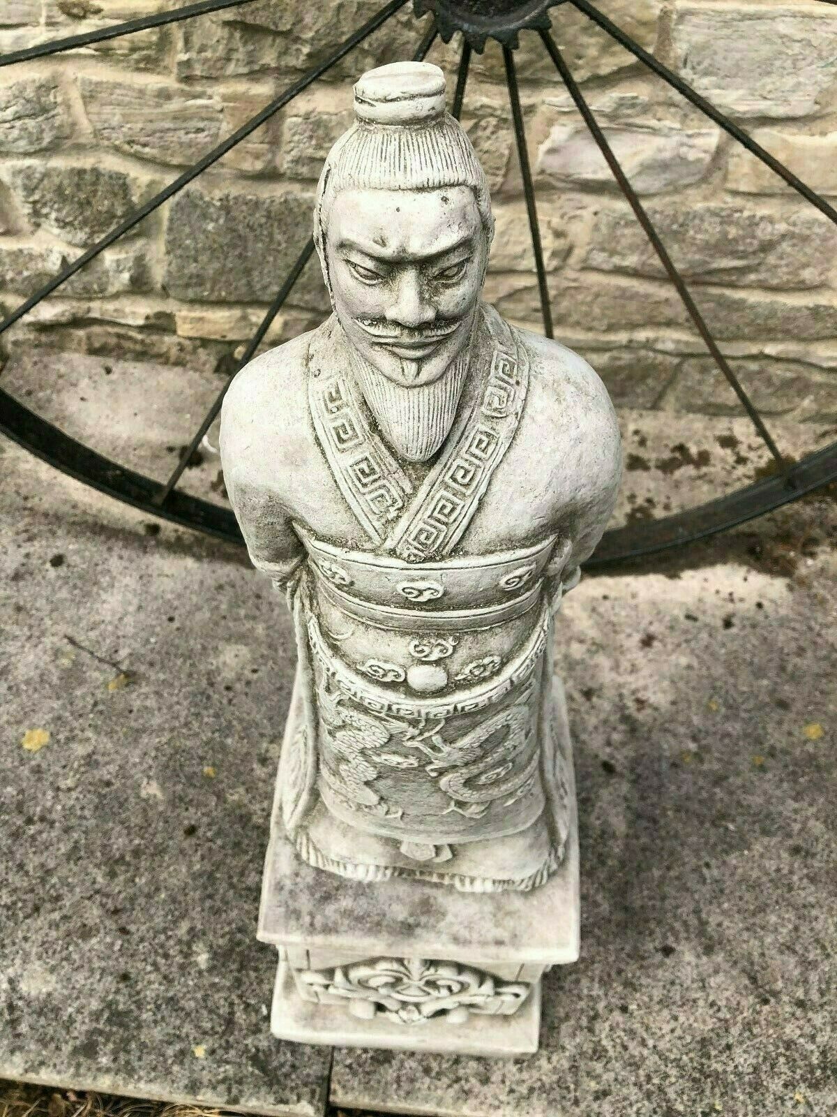Overhead angle of the Zhan Shi Warrior Garden Statue focusing on the head and upper torso, showcasing the statue's textured stone finish.