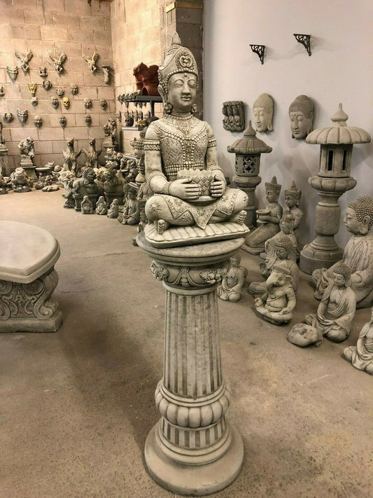 Stone Seated Buddha Statue - Tranquility Garden centerpiece on ornate plinth, ideal for outdoor zen decor and meditation spaces.