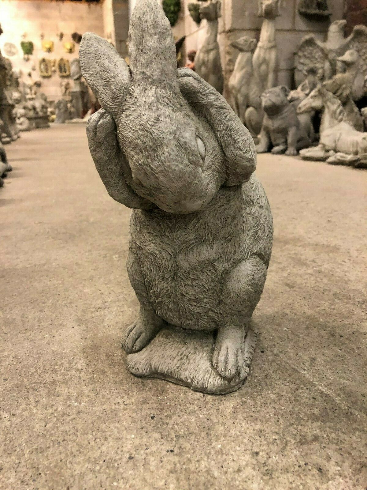 Hear No Evil rabbit statue with paws over ears, crafted from durable stone for outdoor garden or lawn display.