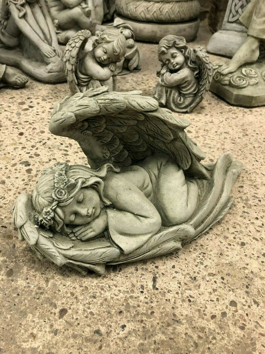 Stone Angel Tiara Ornament for garden decor featuring a sleeping angel with floral tiara and detailed wings. Antique grey finish for outdoor use.