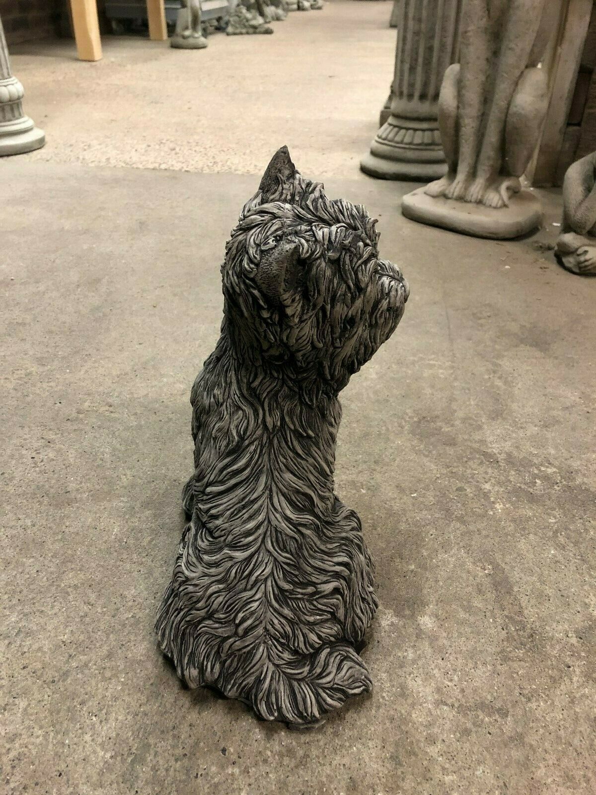 Side view of Westie Dog Statue - Stone Sculpture with realistic fur design. Ideal garden ornament for lawns, patios, or porches.