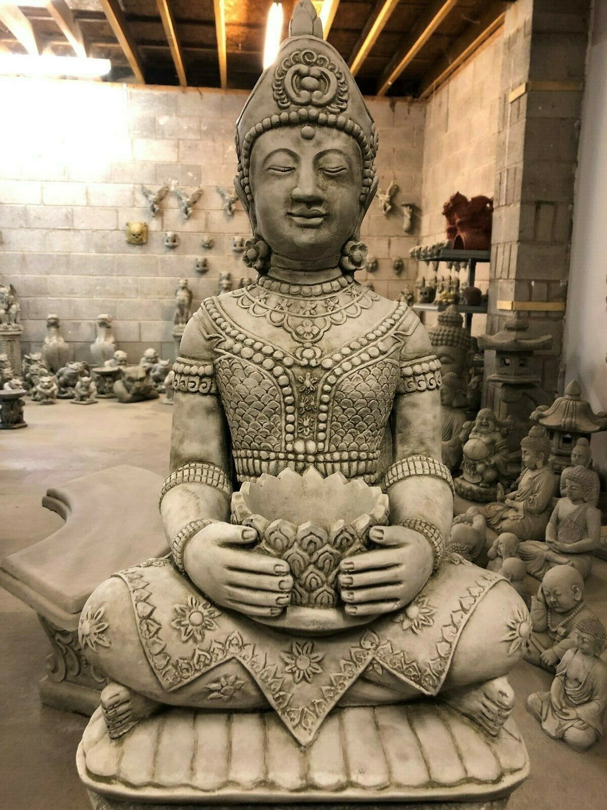 Close-up of detailed Stone Seated Buddha Statue showing intricate carvings and serene expression, perfect for garden tranquility.
