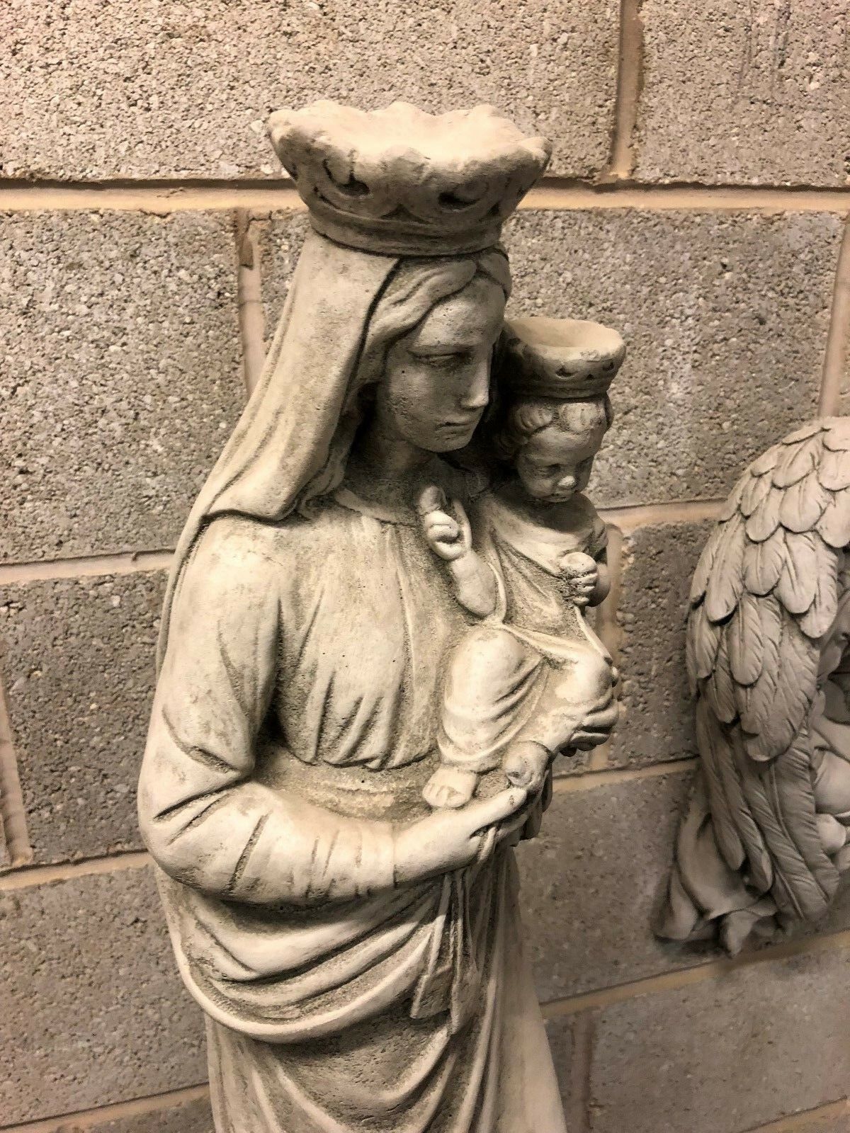 Angled view of Mary & Jesus statue in antique grey finish, highlighting religious symbolism and stone craftsmanship for garden or porch decor.