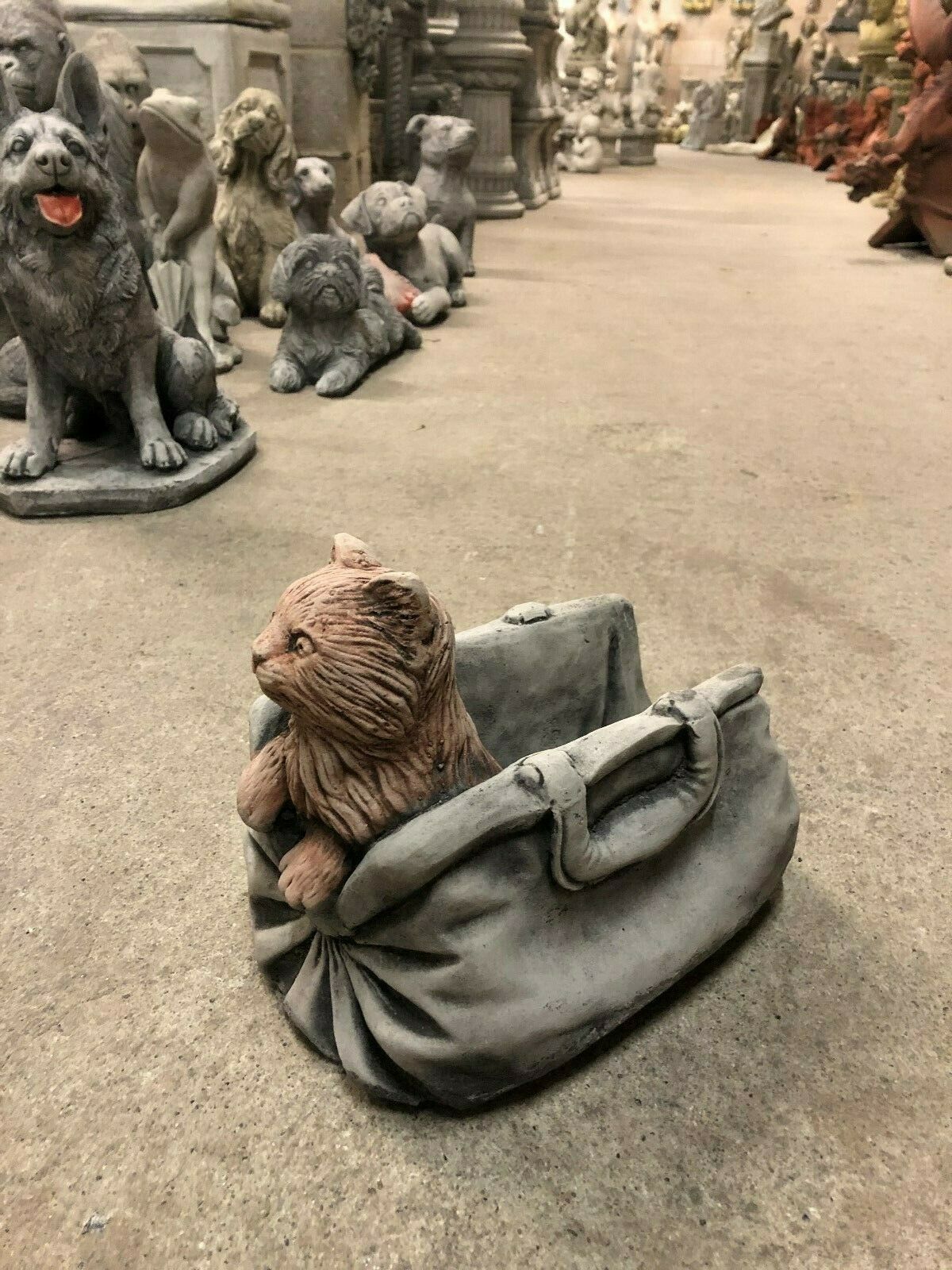 Stone Cat In Bag Planter with antique limestone finish, featuring a detailed cat sculpture peeking from a realistic handbag-shaped planter.