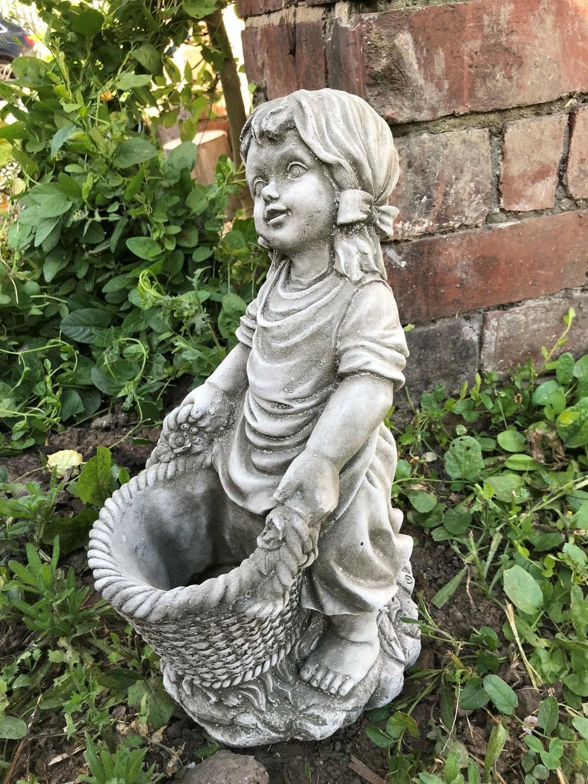 Stunning Stone Basket Girl Garden Planter Ornament featuring a barefoot girl holding a woven basket, ideal for outdoor flower displays.