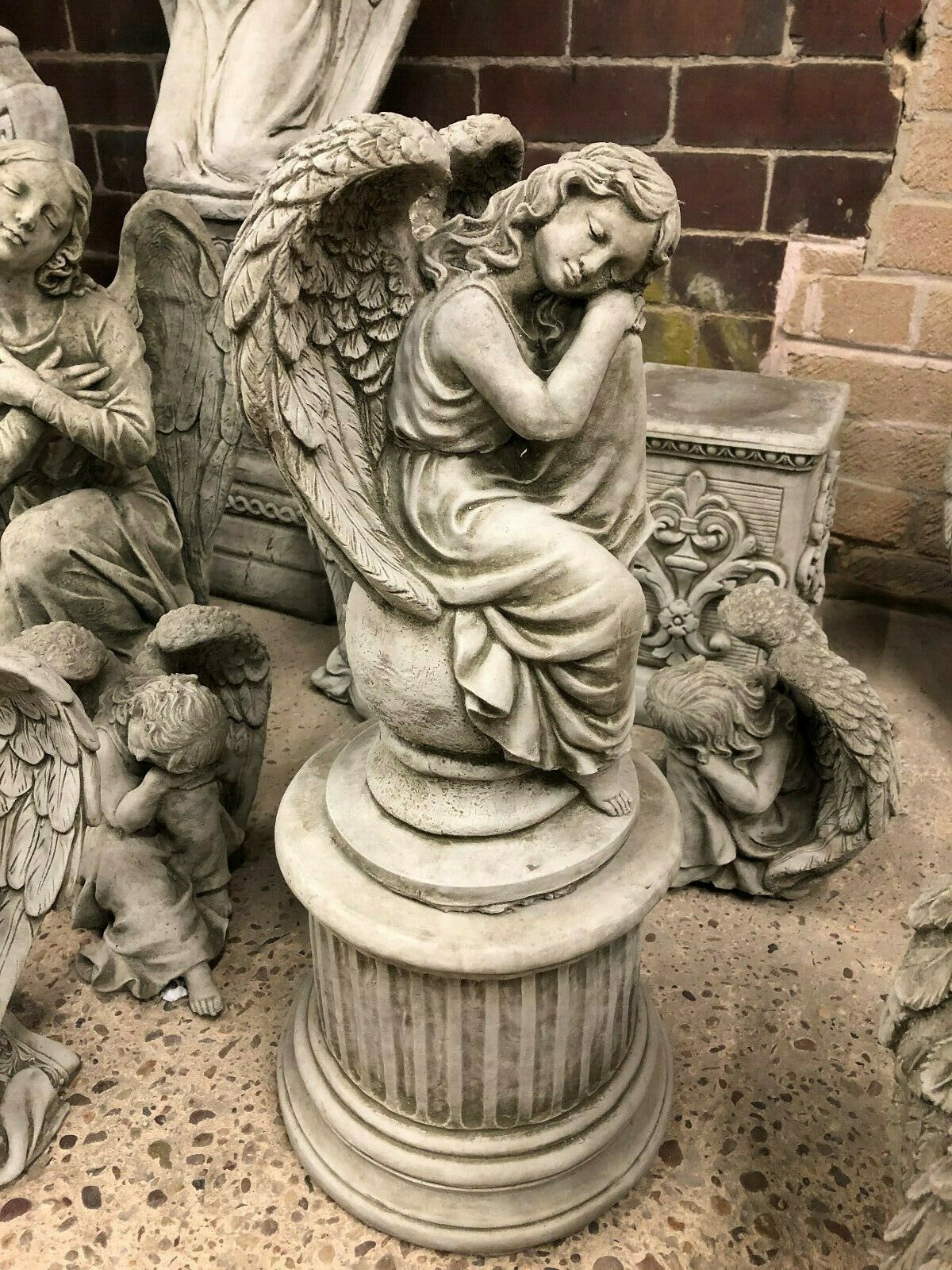 Elegant Stone Angel Garden Statue - On Ball Plinth, ideal for memorial or garden decor, crafted from durable limestone with intricate detailing.
