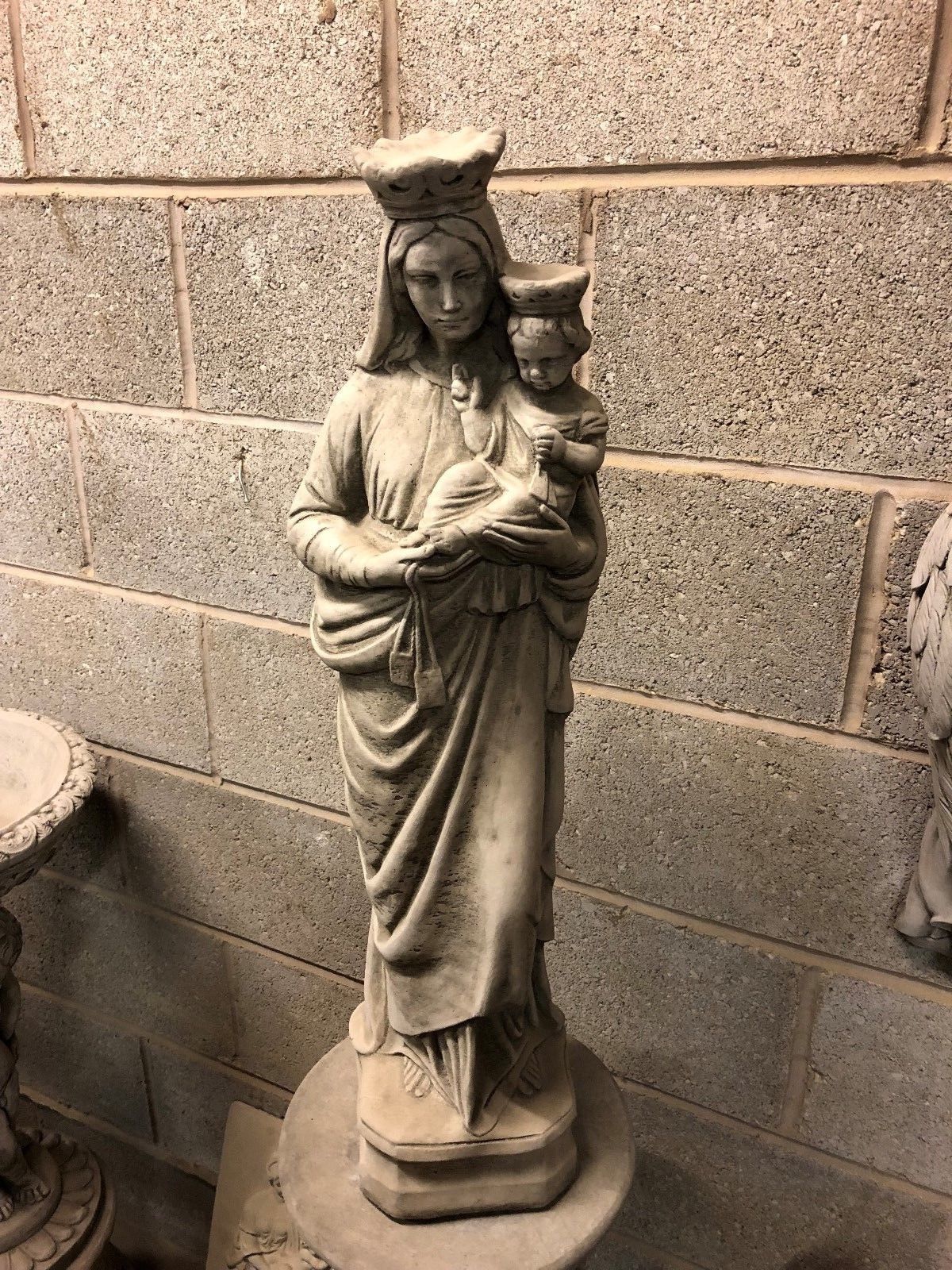 Full view of limestone Mary & Jesus statue with antique grey patina, perfect for outdoor religious ornament or grave marker in UK gardens.