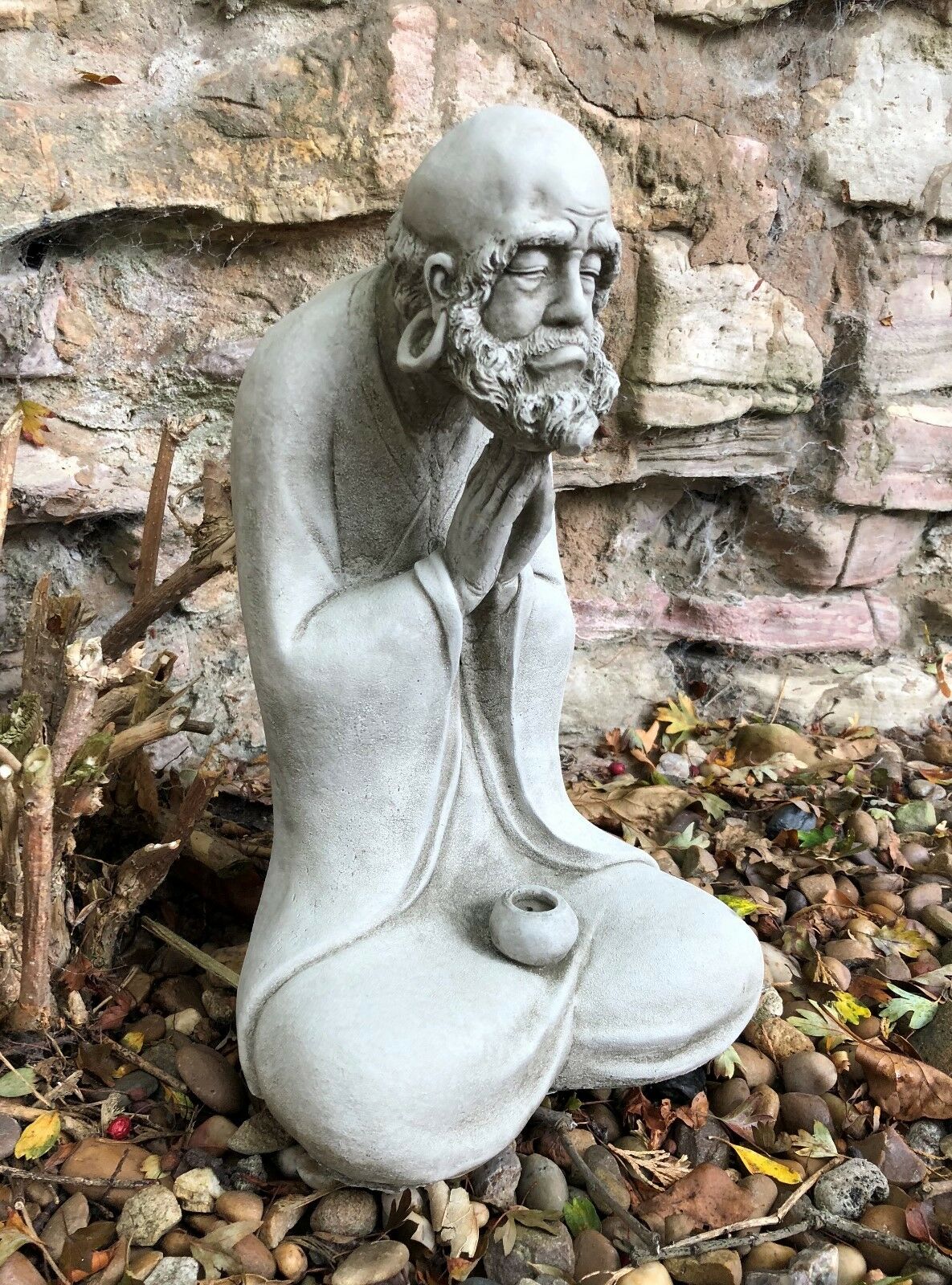 Right side view of the Stunning Stone Praying Old Monk Sculpture Garden Ornament, emphasizing its weathered stone texture and peaceful design.