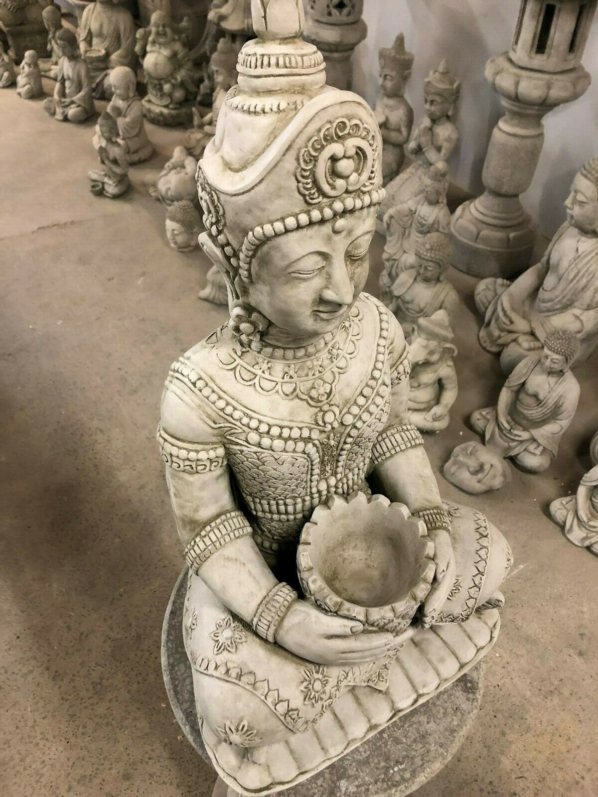 Top angle of Stone Seated Buddha Statue highlighting lotus bowl and fine ornamental details, enhancing outdoor serenity.