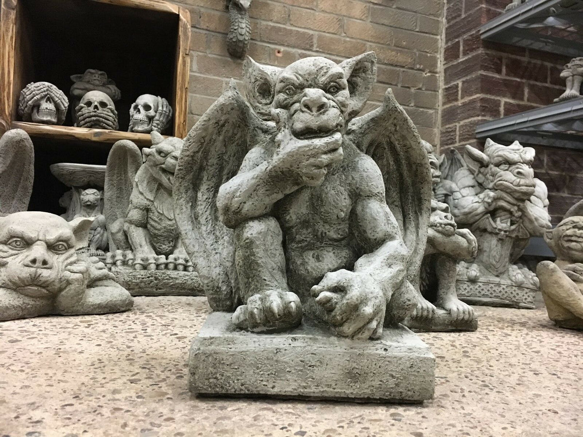 Thoughtful winged gargoyle statue in stone finish, ideal for enhancing mystical garden or lawn aesthetics.