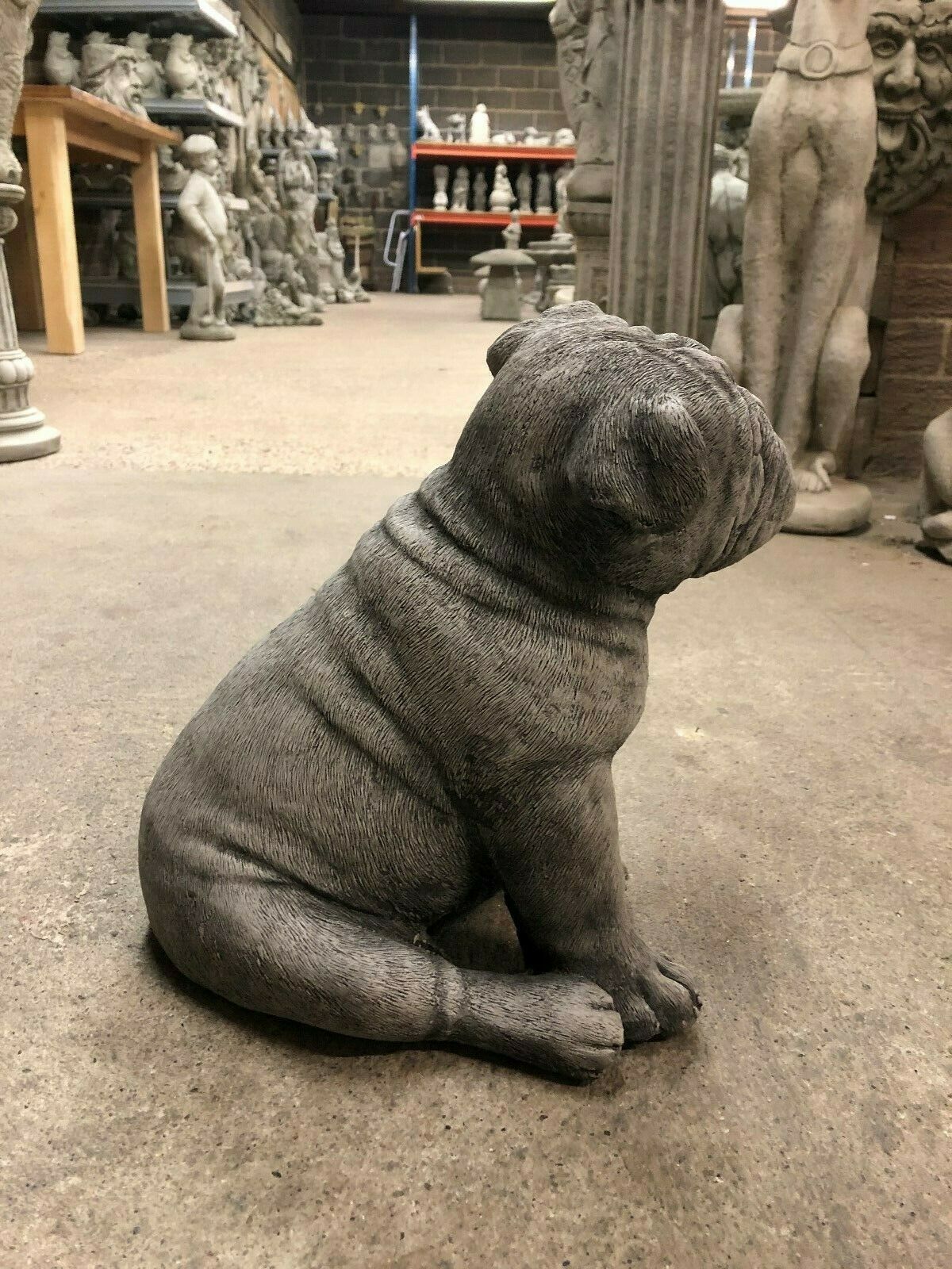 Side angle of the Durable Bulldog Stone Statue - British Puppy, emphasizing its sturdy build and realistic design for outdoor spaces.