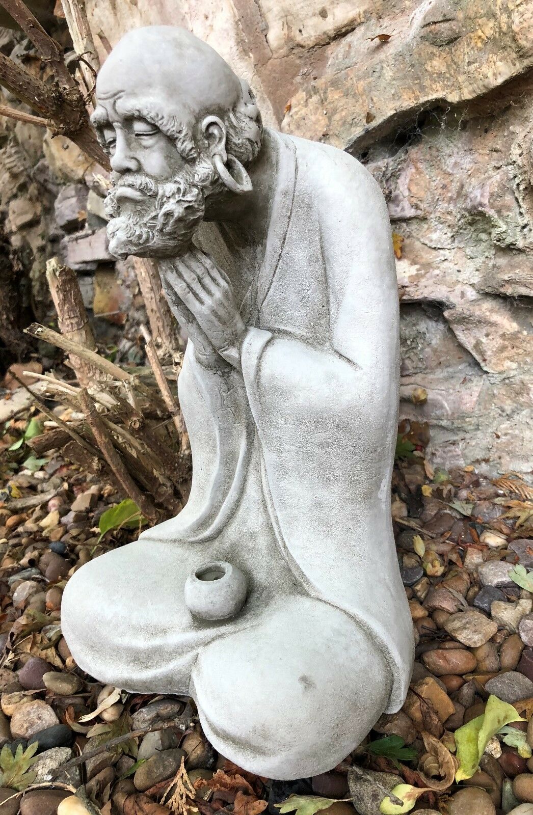 Left side view of the Stunning Stone Praying Old Monk Sculpture Garden Ornament, perfect for spiritual garden ambiance and outdoor decor.