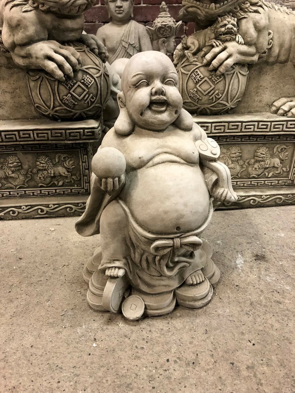 Detailed limestone Buddha statue for wealth, featuring joyful expression and symbolic elements, suited for home or garden use.