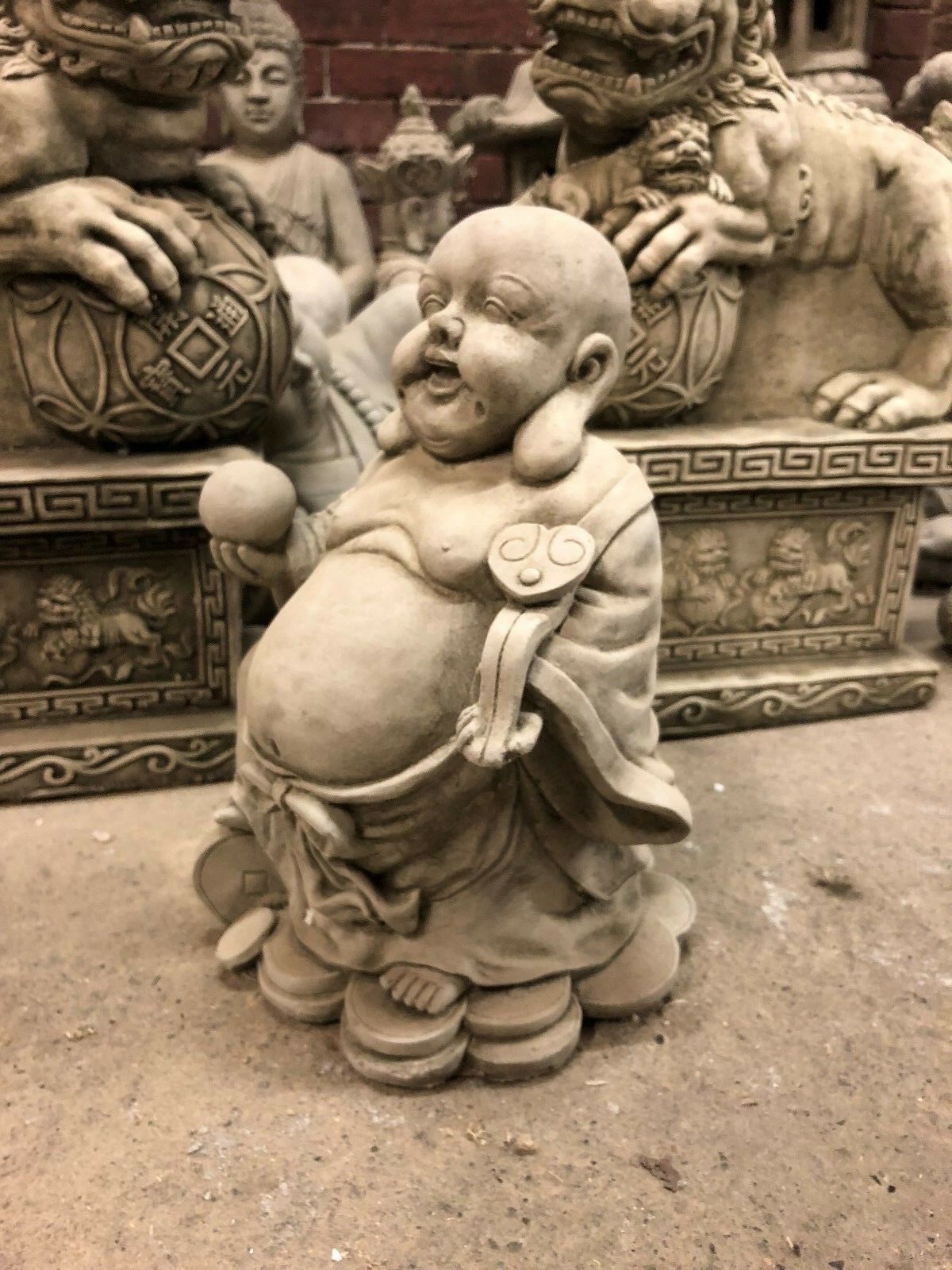 Prosperity Buddha statue in solid stone, showcasing intricate craftsmanship and traditional symbolism for outdoor decoration.
