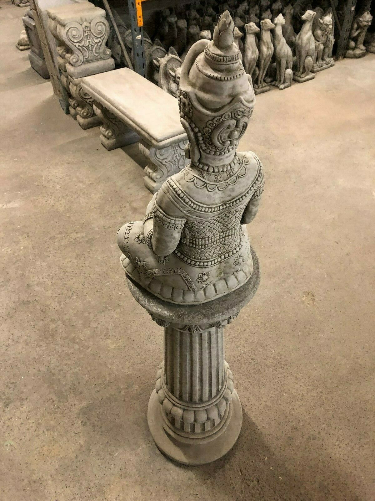Angled rear view of Stone Seated Buddha Statue showing sculpted textures and elevated base, suited for meditation gardens.
