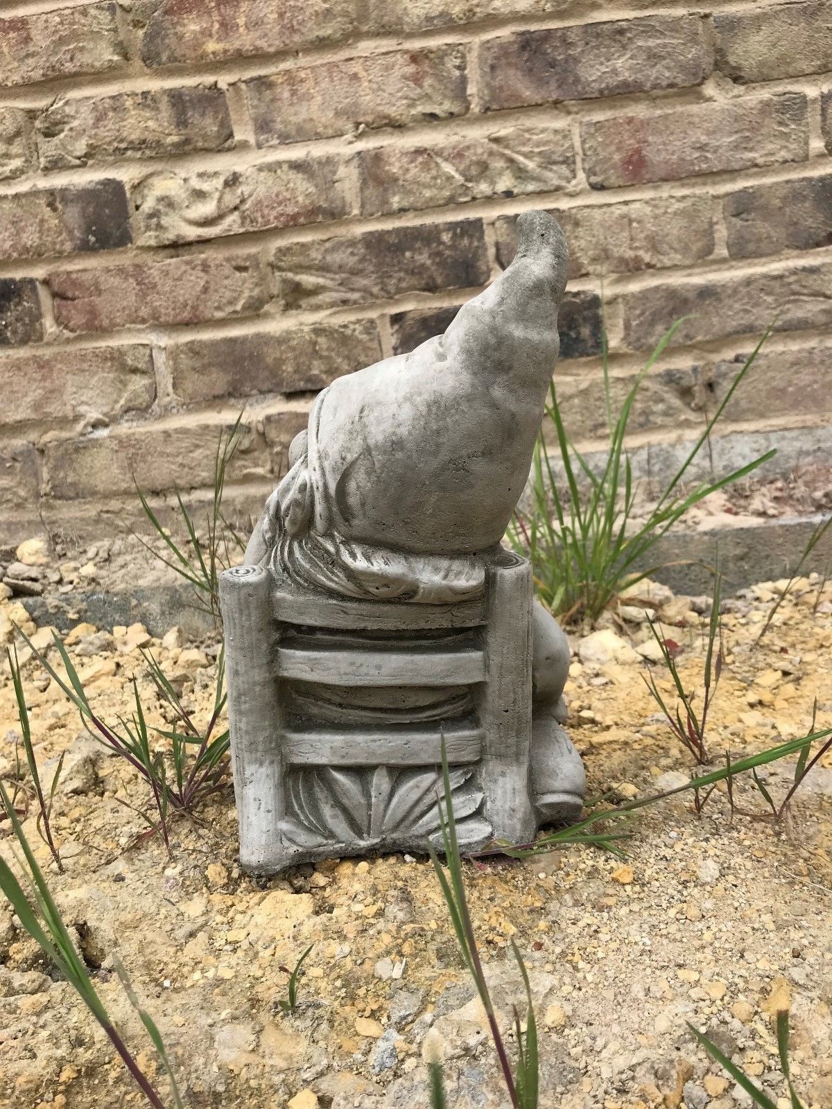 Rear view of Stone Sunbathing Gnome Garden Ornament highlighting the detailed chair design and solid limestone construction.