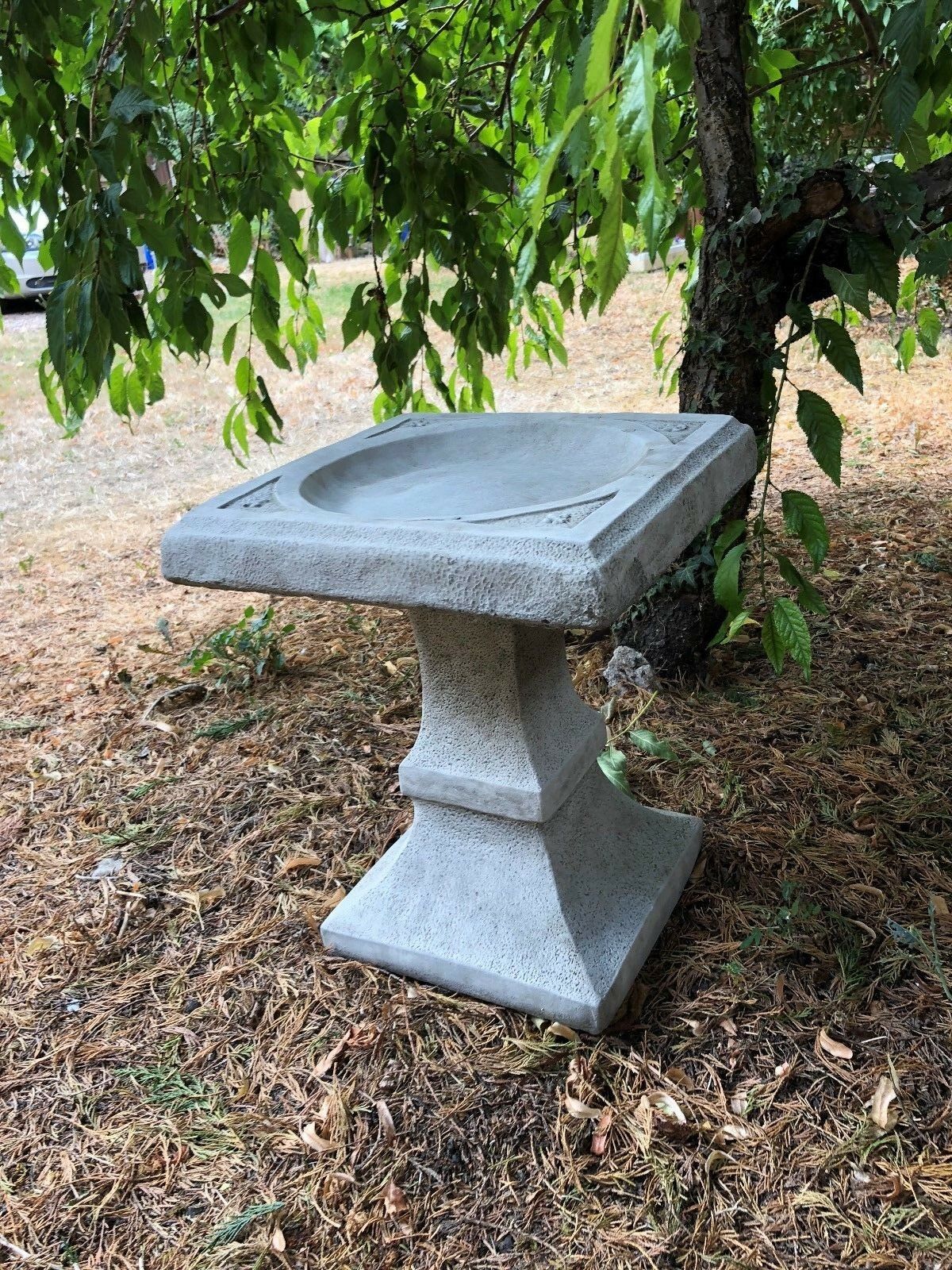 Angled view of Stone Square Bird Bath - Design Sculpture with detailed corner accents, ideal for stylish garden or patio settings.