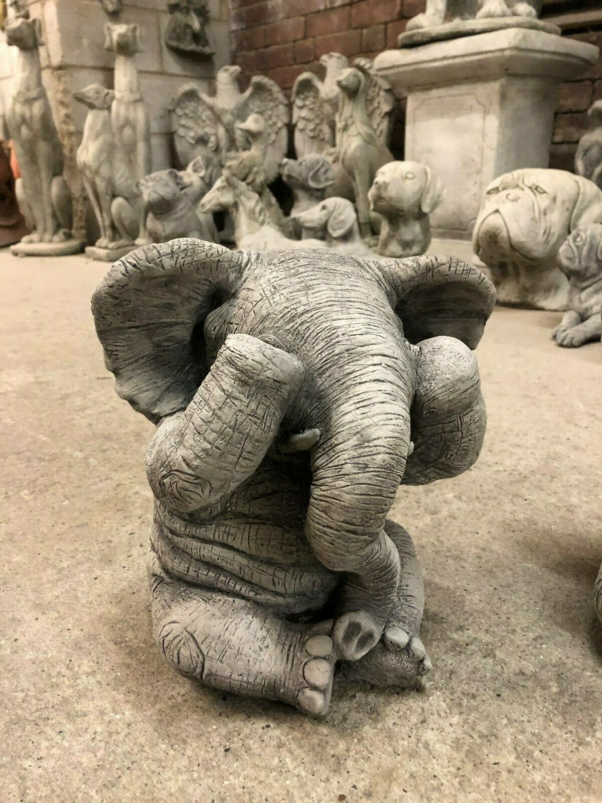 Stone elephant ornament covering eyes, symbolizing 'See No Evil' from the Elephant Ornaments - Hear, See & Speak No Evil garden sculpture set.