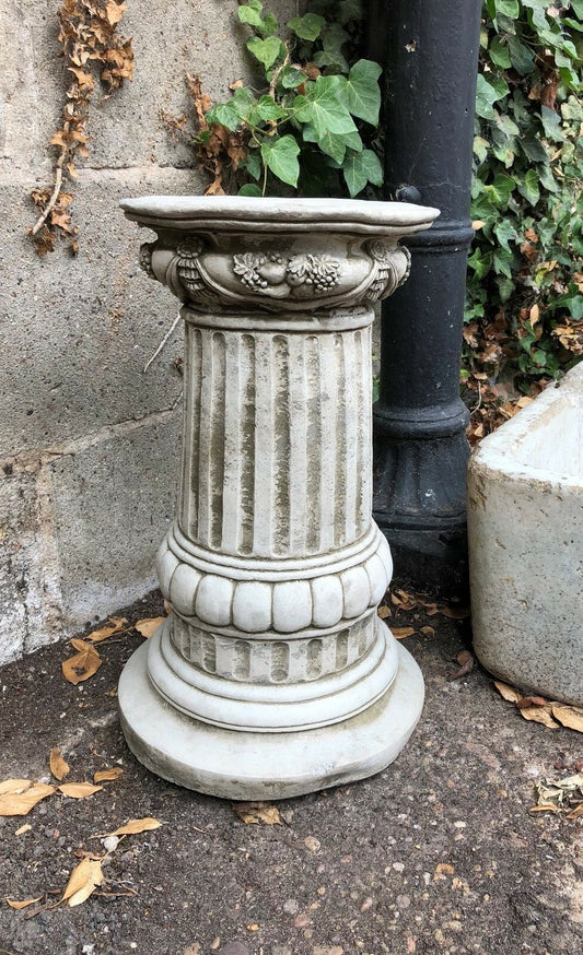 Stone Floral Plinth - Garden Ornament with ornate floral carvings and fluted column design, ideal for outdoor garden sculpture display.