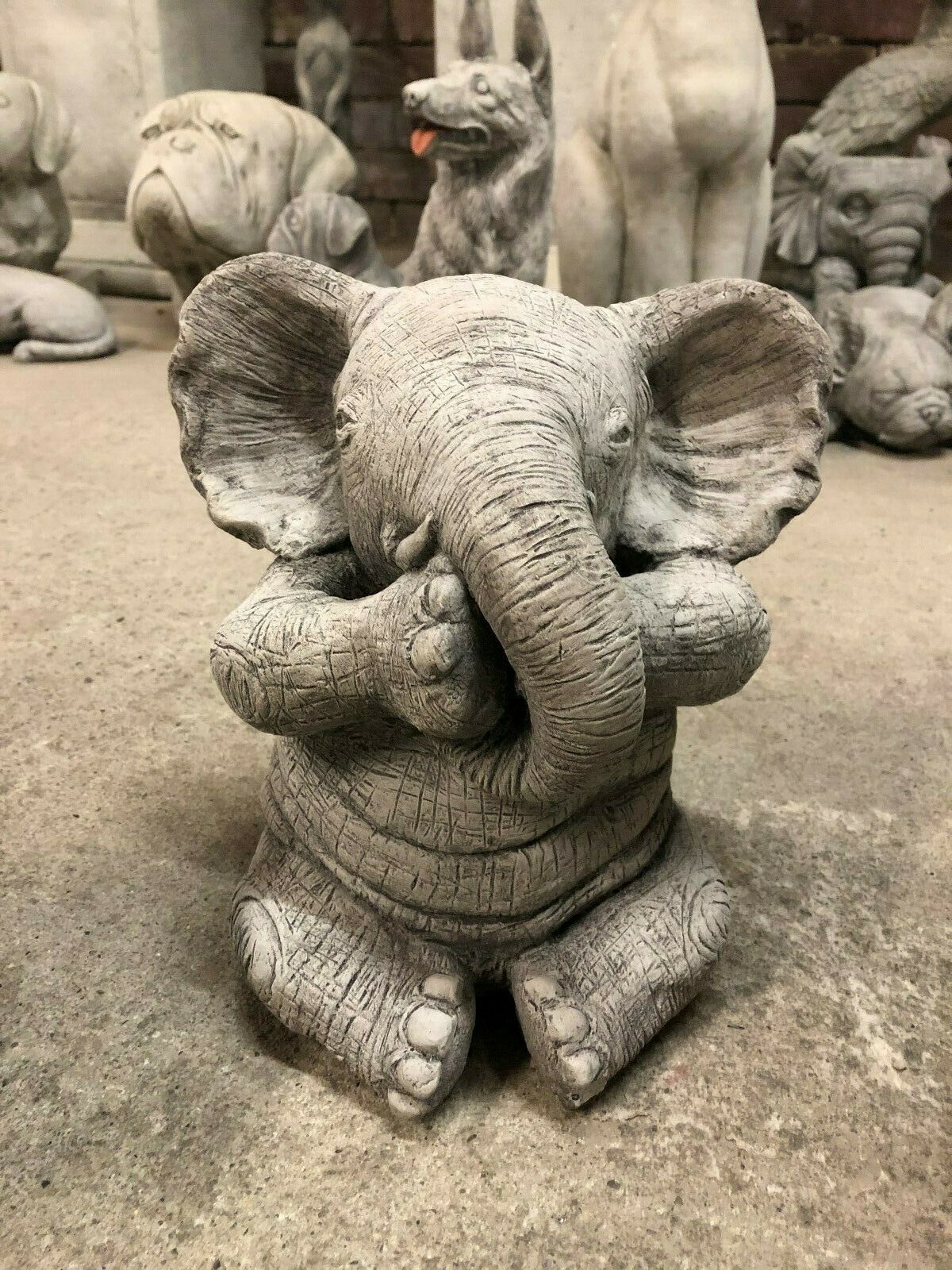 Stone elephant ornament covering mouth, depicting 'Speak No Evil' from the Elephant Ornaments - Hear, See & Speak No Evil limestone decor trio.