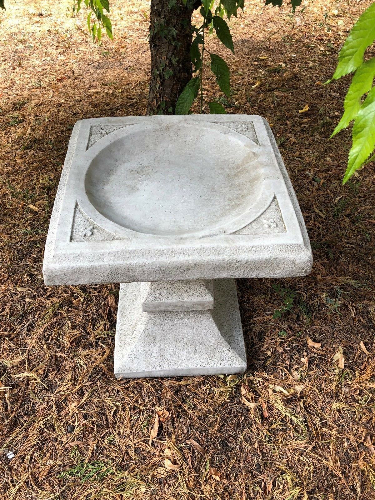 Top view of Stone Square Bird Bath showing its shallow bowl and decorative square design, crafted from weatherproof limestone.