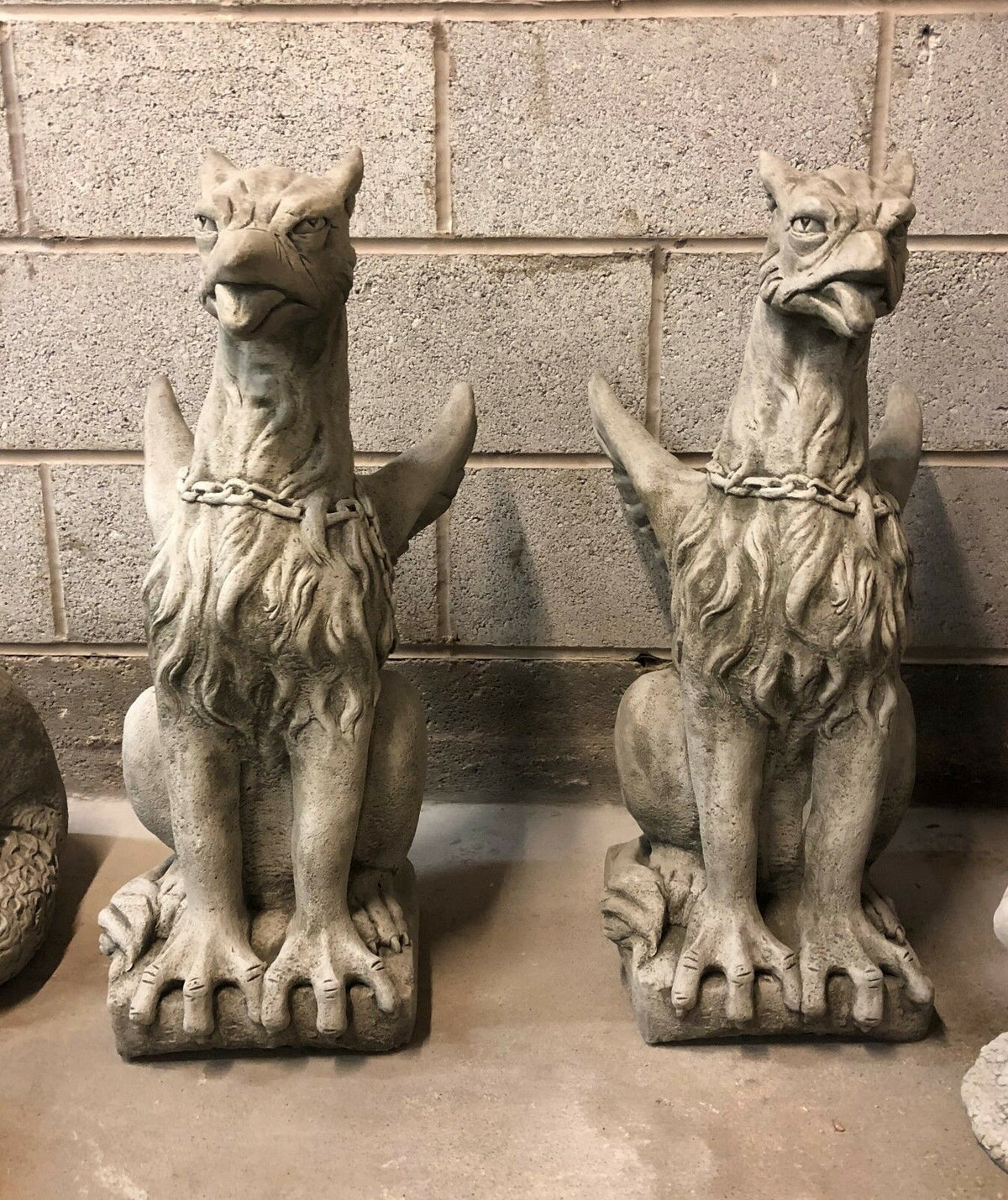 Pair of majestic limestone phoenix statues with antique grey finish, ideal as stone guardians for garden entrances or patios.