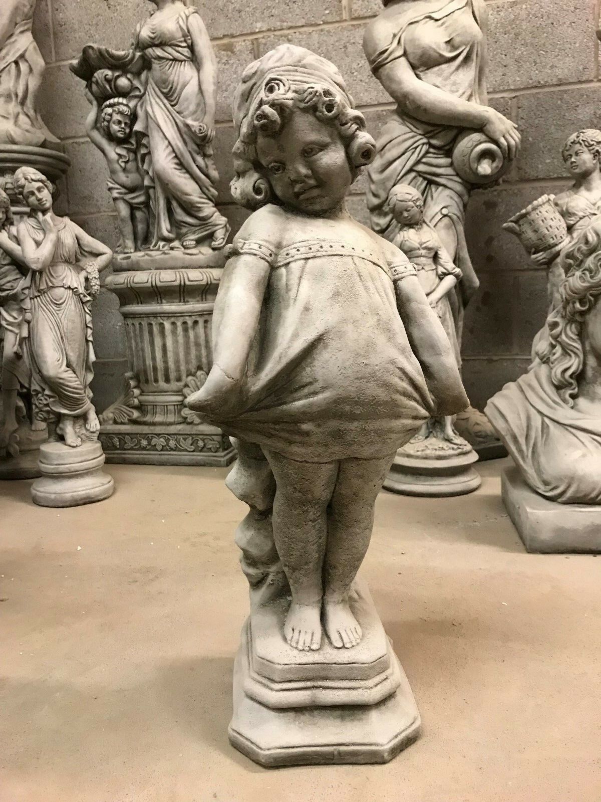 Charming Shy Girl Garden Sculpture made from solid limestone, perfect for patios and gardens with its ice-resistant stone design.