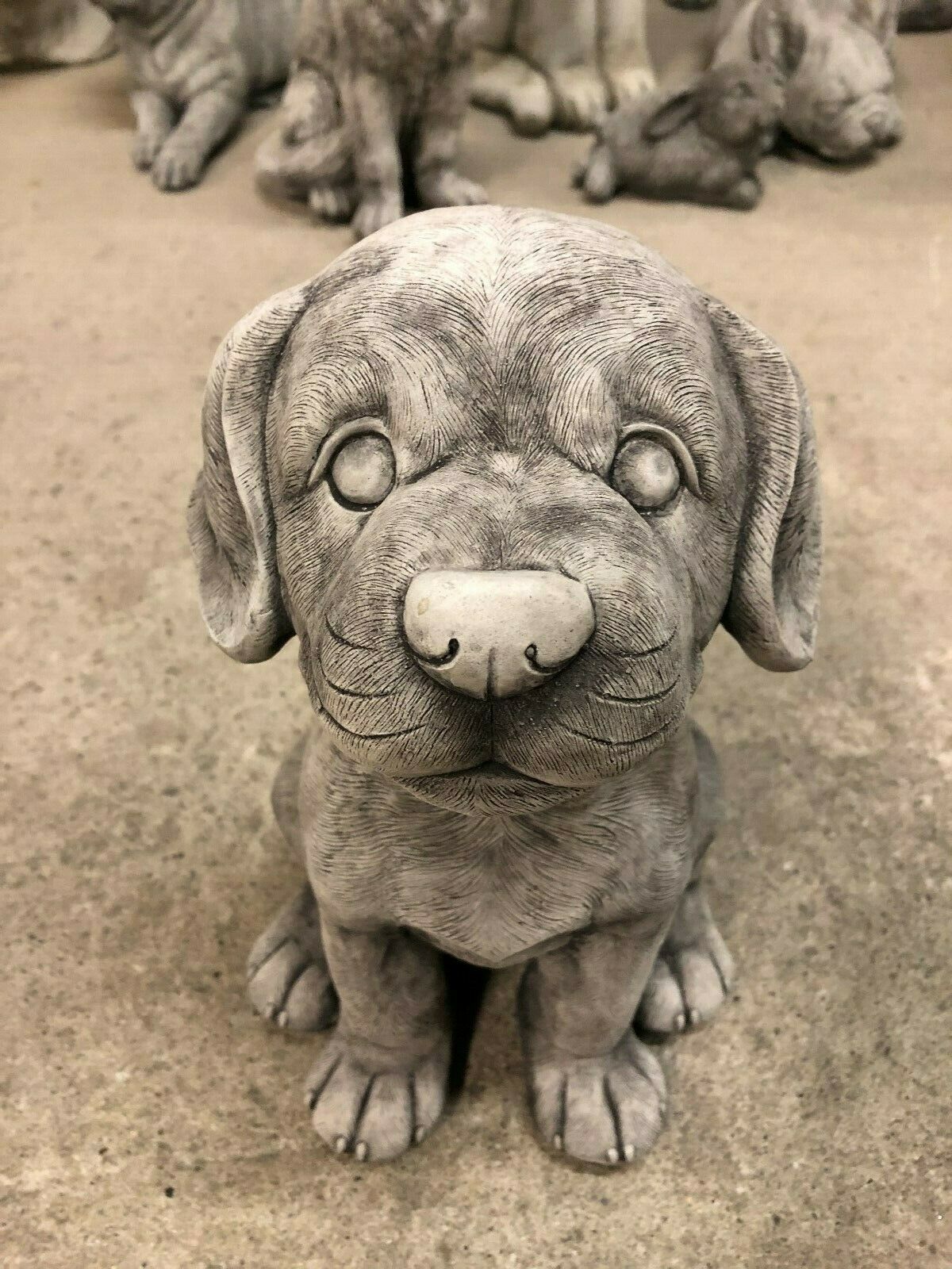 Front view of stone puppy garden ornament with lifelike detailing and antique grey finish. Perfect for enhancing patios or garden spaces.