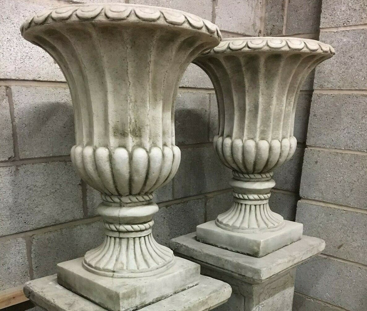 Side view of Stone Urn Planters with Georgian design, showcasing intricate fluted carvings and solid limestone base for patio or lawn use.