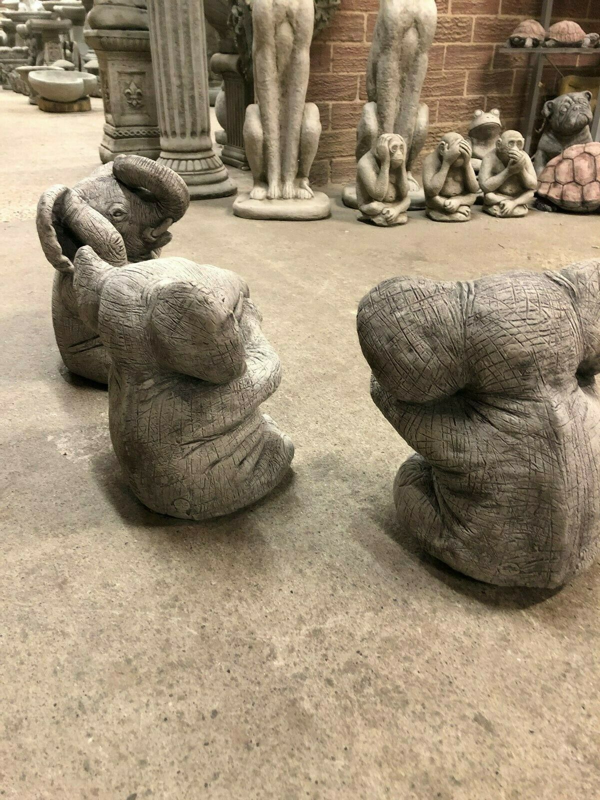 Rear view of stone Elephant Ornaments trio, showcasing antique grey finish and solid limestone build for outdoor garden decor.