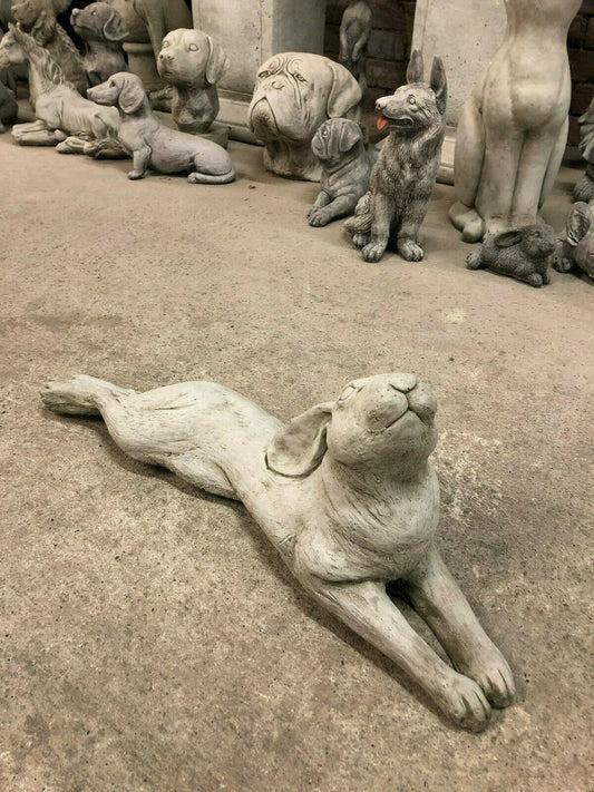 Laying Down Stone Hare garden ornament with antique finish, crafted from durable limestone, ideal for outdoor lawn or patio decor.