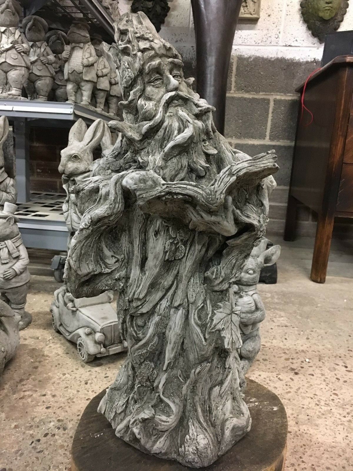 Full view of Wizard Garden Statue indoors, surrounded by other sculptures, highlighting its detailed magical design.