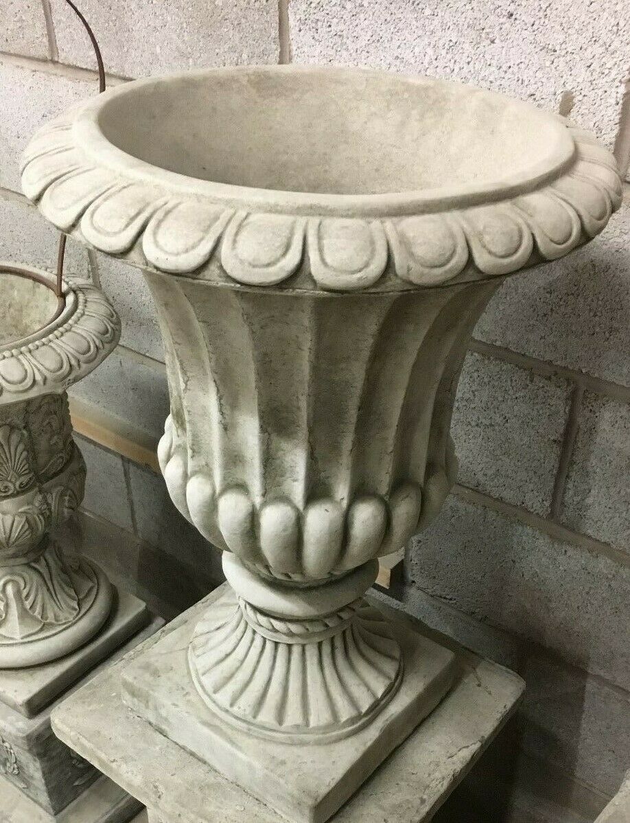 Close-up of a single Georgian-style Stone Urn Planter with ornate rim and vertical fluting, crafted for timeless garden elegance.