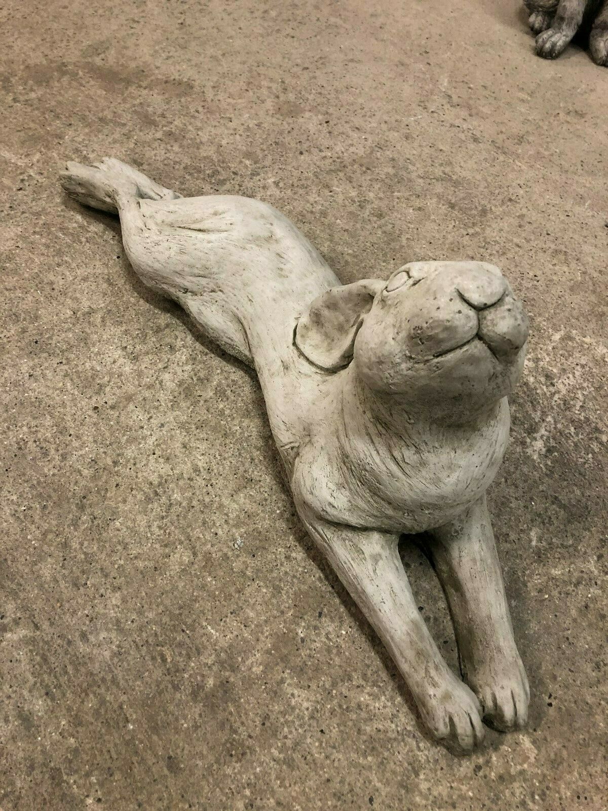 Stone Hare Garden Ornament in a relaxed laying pose, perfect for enhancing flowerbeds or garden pathways with rustic charm.