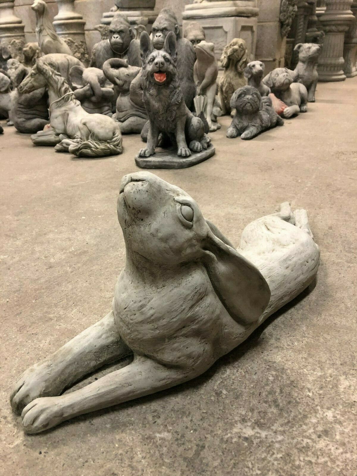 Laying Down Stone Hare sculpture with weather-resistant limestone, adds whimsical detail to garden or balcony spaces.