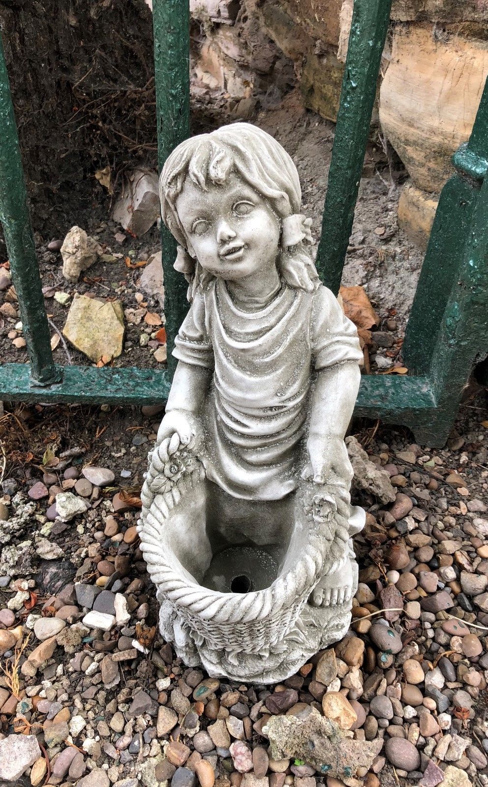 Top view of basket girl garden statue with planter opening, designed for flower planting in home garden or balcony decor.