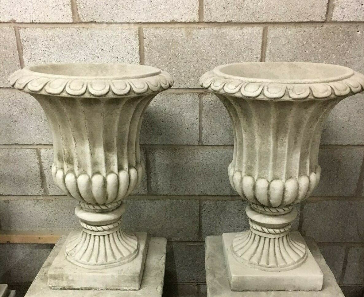 Pair of Stone Georgian Design Urn Planters in antique grey limestone with fluted detailing, ideal for elegant outdoor garden decor.