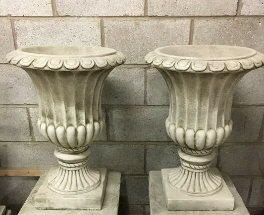 Pair of Stone Georgian Design Urn Planters in antique grey limestone with fluted detailing, ideal for elegant outdoor garden decor.