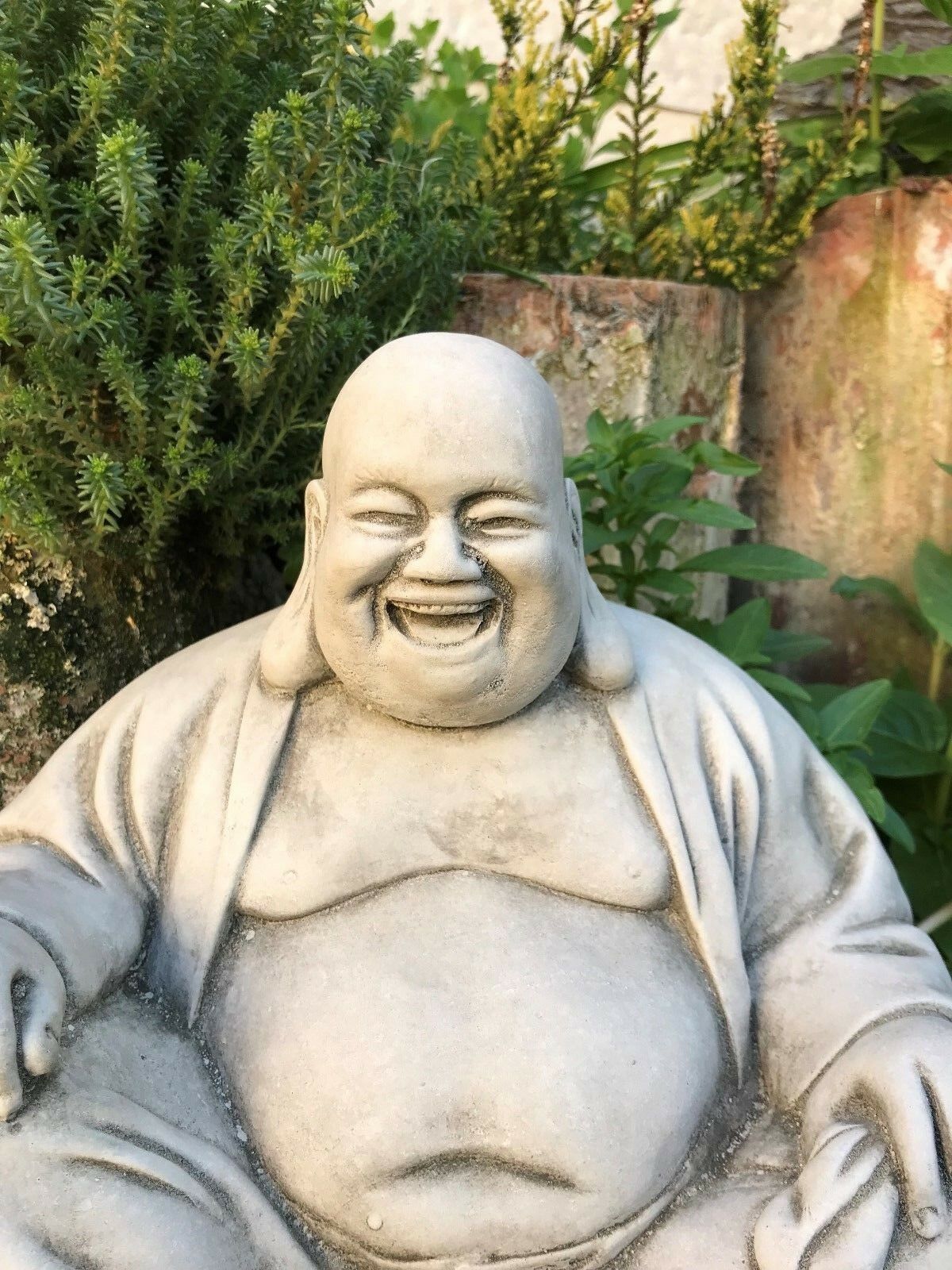 Close-up of Stone Laughing Buddha Ornament showing detailed facial expression and craftsmanship, perfect for outdoor zen garden decoration.