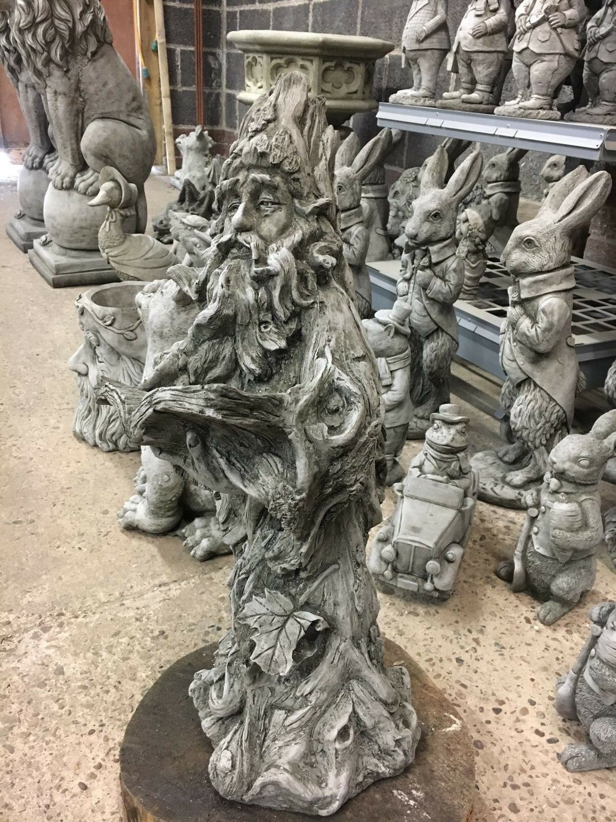Side profile of Wizard Garden Statue with woodland creatures, perfect for whimsical garden sculpture collections.