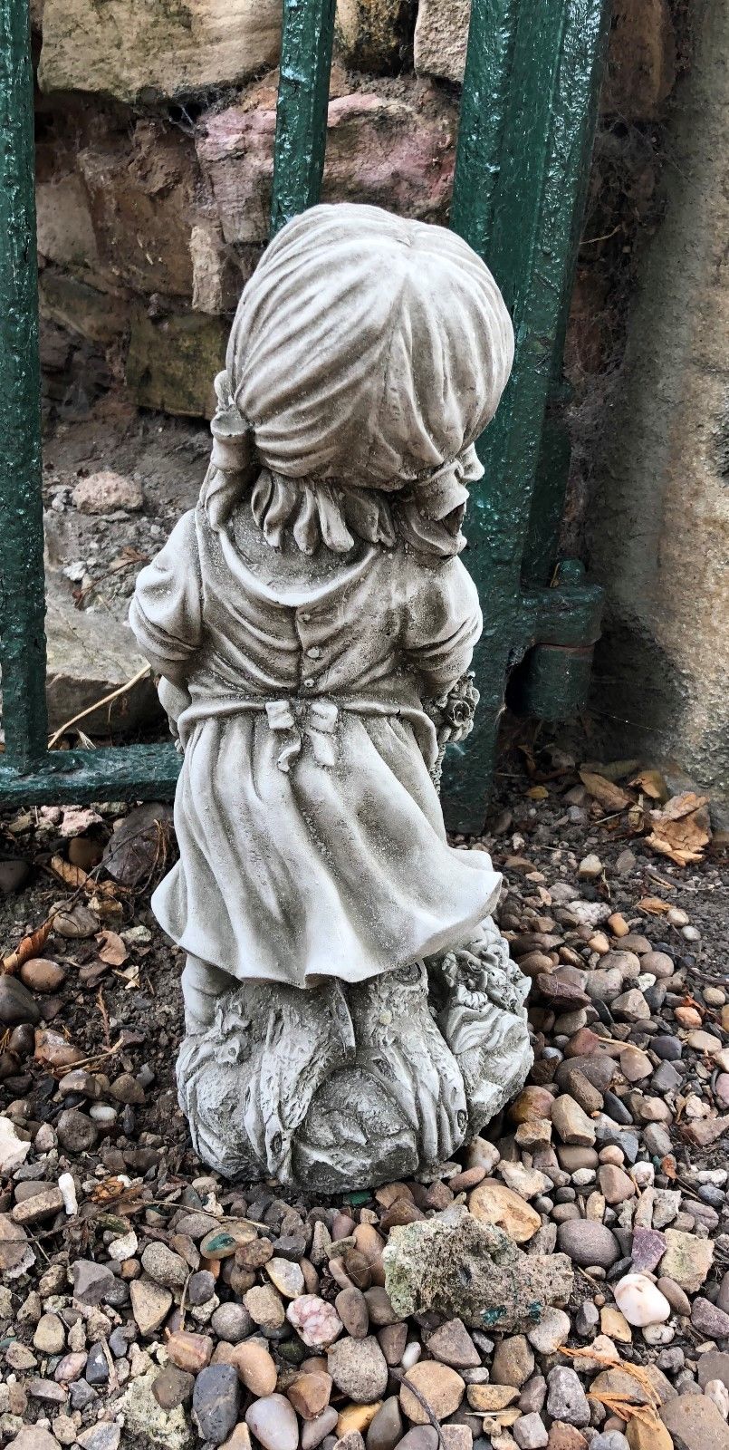 Back angle of basket girl garden statue with intricate stonework, perfect for enhancing outdoor garden aesthetics with classic charm.
